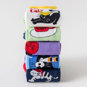 Detail view of five pairs of cotton socks featuring various cute cartoon cat jacquard patterns
