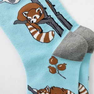 Detailed view of knitted cotton crew sock showing cute red panda pattern and gray heel seam