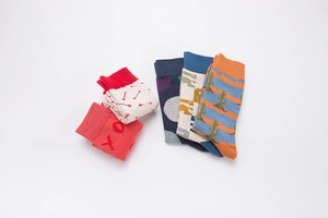 Detail of five pairs of cotton crew socks with assorted jacquard patterns and motifs