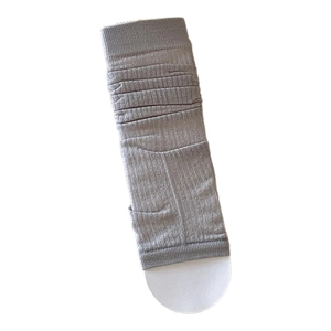 Grey Japanese style ribbed leg warmers with vertical knit texture and stirrup design