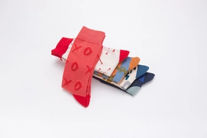 Close-up of assorted cotton crew socks with colorful jacquard patterns and ribbed cuffs