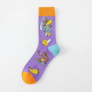 Detail of purple cotton socks featuring cartoon gorilla in spacesuit and surfing prints