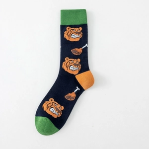 Detailed view of navy cotton sock with orange tiger patterns and green contrast toe