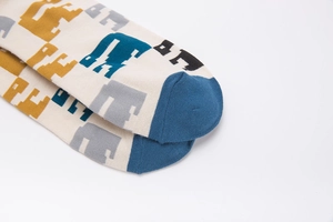 Detailed macro of breathable cotton socks with pixelated animal jacquard and knit texture