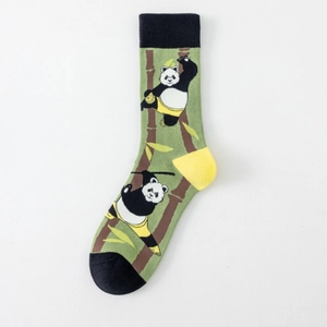 Detail of green cotton socks featuring a panda and bamboo pattern with black cuffs