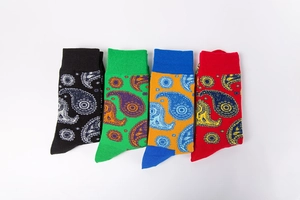 Set of four cotton crew socks featuring vibrant paisley patterns in red green black and yellow