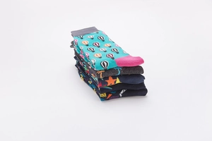 Stack of patterned cotton crew socks featuring hot air balloons and palm trees
