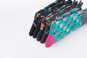 Detailed view of stacked crew socks with various colorful hot air balloon and tree prints