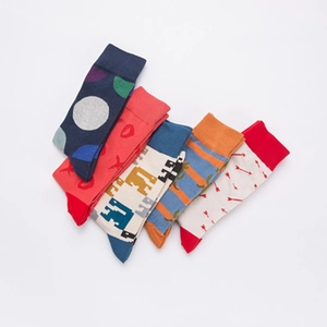Set of five vibrant cotton blend crew socks with dinosaur and heart jacquard patterns
