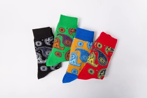 Detailed view of four pairs of cotton crew socks with vibrant paisley jacquard patterns