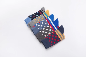 Detailed flat lay of five pairs of colorful polka dot and striped cotton blend socks