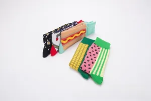 Detail showing five pairs of cotton crew socks with hot dog, corn, and space patterns