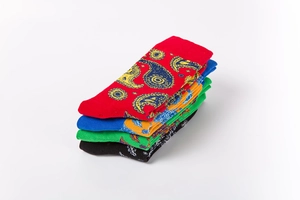 Detail of four colorful vintage paisley crew socks in red, blue, green, and black