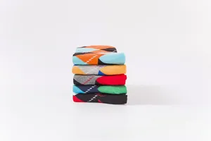 Detail showing five pairs of colorful argyle patterned cotton crew socks for daily wear