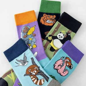 Colorful crew socks with cartoon animal patterns including gorillas and pandas
