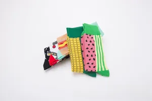 Detailed view of colorful cotton crew socks featuring sushi and watermelon patterns