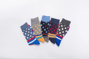 Flat lay of 5-pair colorful crew socks featuring polka dots and striped patterns