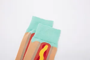 Detail of mint green ribbed cuff and colorful hot dog jacquard pattern on cotton socks