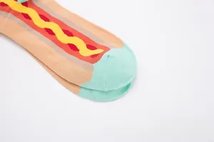 Close-up of knit hot dog pattern socks with colorful patchwork and reinforced toe stitching