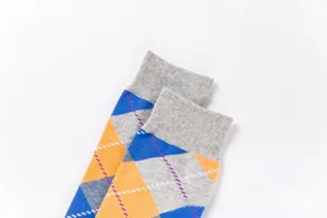 Close-up of knit cotton crew socks featuring classic colorful argyle patterns