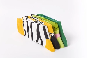 Detailed stack of colorful cotton crew socks with vibrant patterns and ribbed cuffs