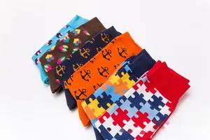 Assorted colorful patterned crew socks featuring geometric, anchor, and puzzle designs