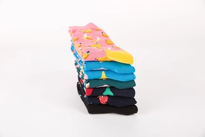 Close-up of assorted crew socks with vibrant fruit patterns and ribbed elastic cuffs