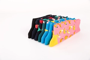 Detail of colorful fruit pattern crew socks with ribbed cuffs and reinforced heels