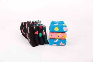 Detail view of colorful cotton crew socks featuring various vibrant fruit patterns