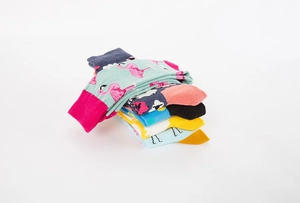 Detail of colorful Easter socks set featuring mint flamingo and navy floral patterns