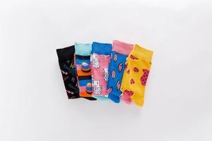 Detailed close-up of 5-pack crew socks with colorful street art graphics and cotton knit texture