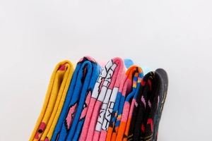 Macro detail of vibrant colorful cotton socks showing texture and knitted patterns