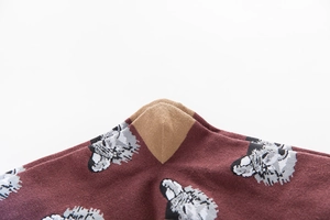 Close-up of knit cotton sock featuring realistic animal print and reinforced khaki heel