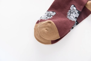 Close-up of wolf jacquard knit socks featuring precise toe stitching and premium texture