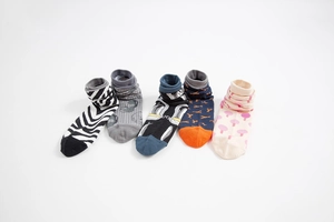 Detail showing five pairs of cotton socks with zebra, lobster, and mushroom patterns