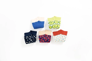 Detail of five colorful patterned mid-tube casual socks featuring fruit and geometric prints