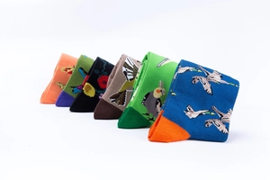 Detail of six pairs of mid-calf socks with colorful bird and floral embroidery patterns
