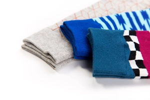 Detailed close-up of colorful geometric knitted socks with high-elastic ribbed cuffs