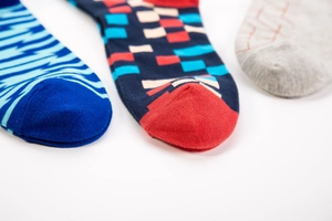 Macro shot showing diverse geometric patterns and fabric texture of cotton crew socks