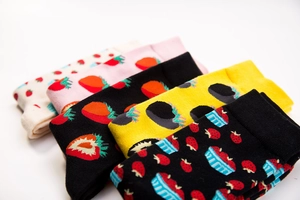 Detail of colorful cotton crew socks featuring various cute strawberry prints and patterns