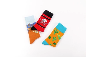 Flat lay of cotton crew socks featuring pirate skull, cactus and octopus patterns