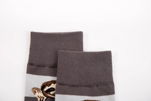 Detail of ribbed cuff and sloth pattern on cotton casual crew socks in grey and light grey