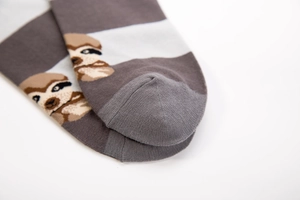 Detail view of cotton sloth socks showing gray stripes and reinforced heel stitching