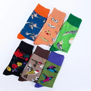 Set of six cotton crew socks featuring colorful bird, butterfly, and floral patterns