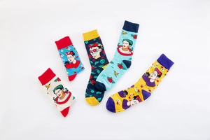 Detailed flat lay of Frida Kahlo themed cotton socks with colorful artistic floral patterns