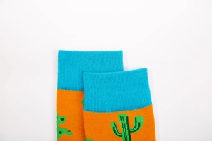 Detailed close-up of ribbed cuffs on cotton crew socks with green cactus pattern