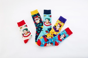 Detailed flat lay of cotton mid-calf socks with artistic Frida Kahlo inspired folk patterns