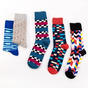 Five pairs of cotton crew socks with geometric patterns like stripes and pixels