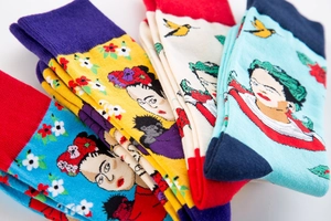 Detailed view of colorful jacquard crew socks with Frida Kahlo artistic portraits