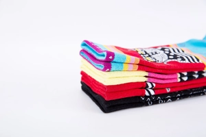 Close-up of vibrant mid-calf cotton socks featuring colorful jacquard patterns and textures